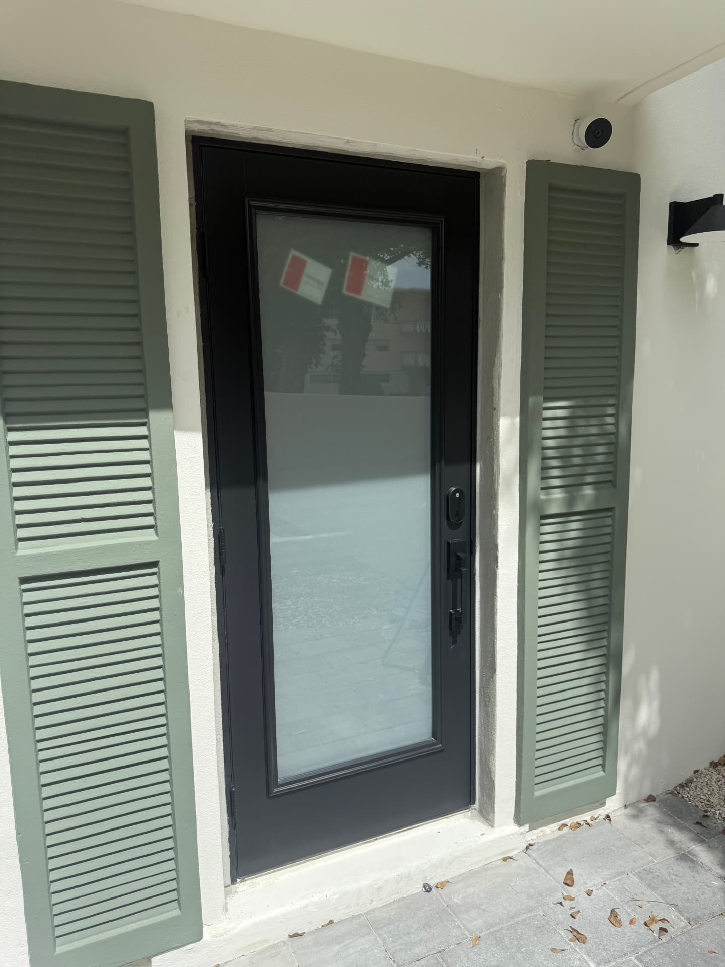 Black full-lite fiberglass entry door with frosted impact glass