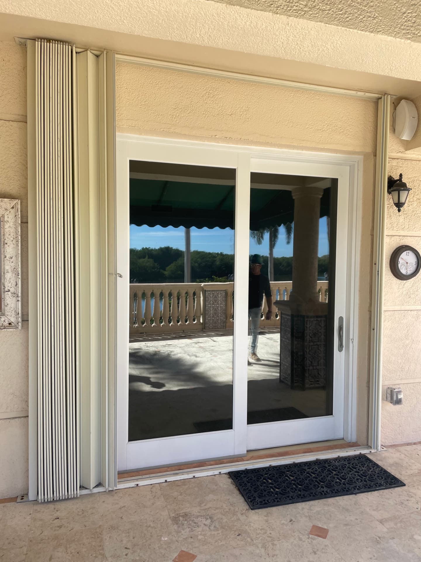 White aluminum impact sliding glass door, waterfront home